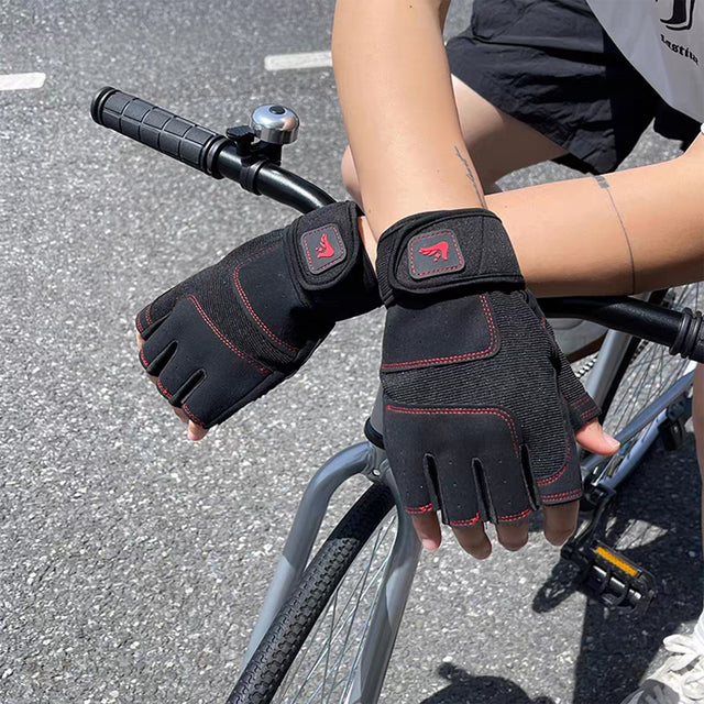 Man wearing black and red gym workout gloves while cycling outdoors – breathable fitness gloves for gym, cycling, and training.