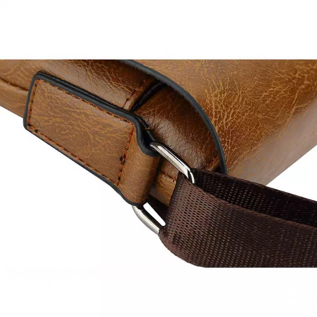 Close-up detail of the durable strap attachment and hardware on the Jeep Buluo men's leather-style messenger bag.