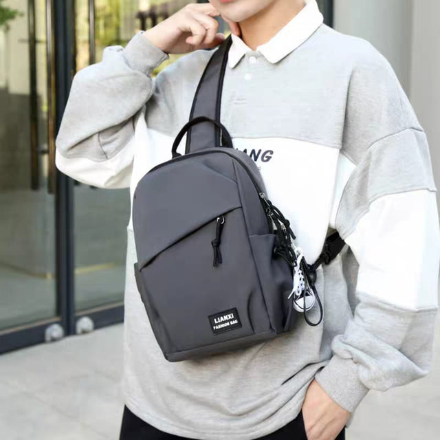 Detailed view of LIANXI chest bag storage capacity, showing compartments for water bottle, headphones, tablet, and power bank