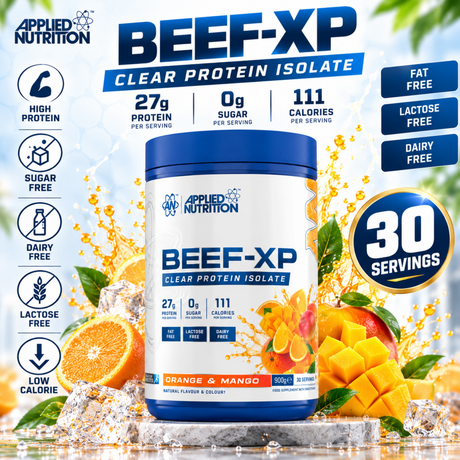 Applied Nutrition BEEF-XP Clear Protein Isolate in Orange & Mango flavor. The 900g tub highlights 30 servings, 27g of protein, 0g of sugar, and 111 calories per serving, along with dairy-free and lactose-free tags. The container is displayed with fresh orange slices, diced mango, ice cubes, and a beverage splash