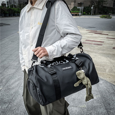 Large capacity sports and gym duffel bag with multiple compartments and adjustable shoulder strap
