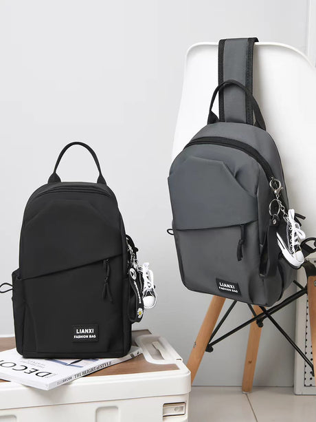 Black and grey LIANXI fashion chest bags for men, side-by-side view, showing durable waterproof material.