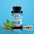 KSM-66 Ashwagandha extract supplement bottle by Warrior, featuring a sprig of the herb, the dried root, and 90 servings of the finished capsules.